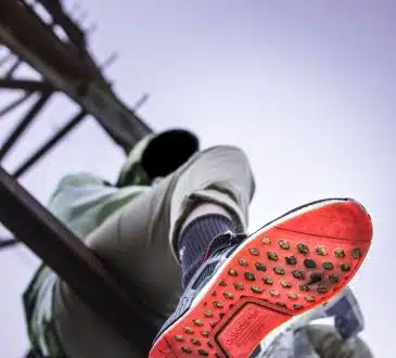 Man Sitting on Tower Base