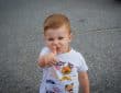 a baby with his finger in his mouth
